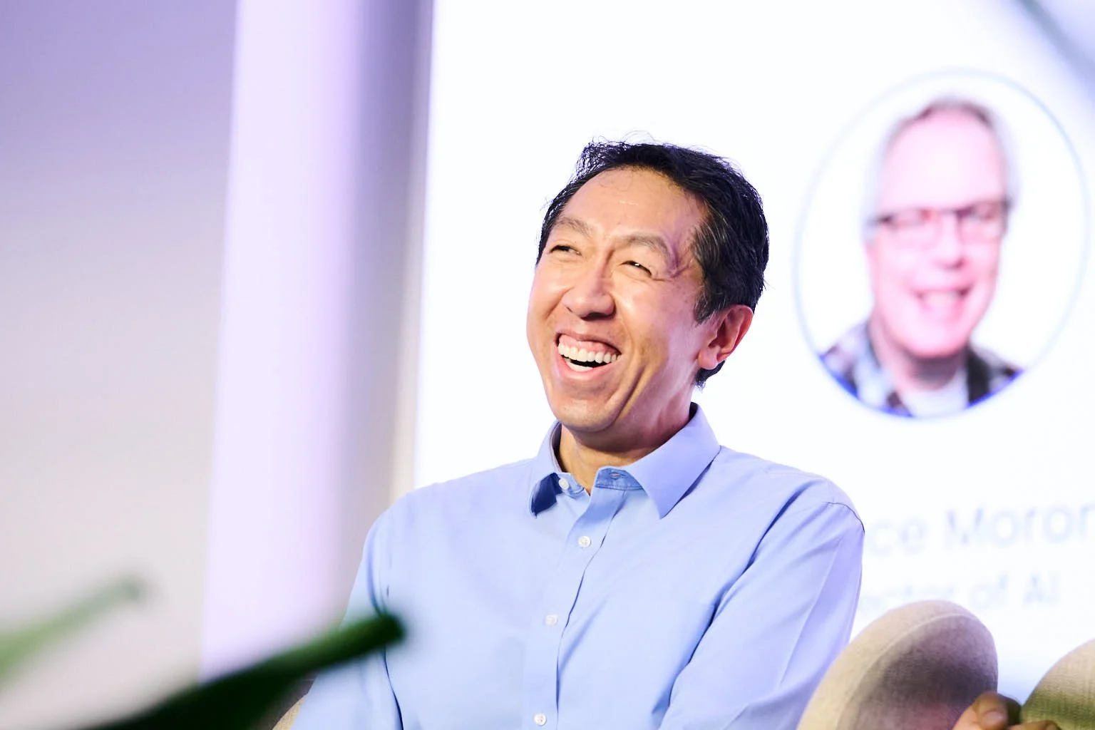 Event Photograph of Andrew Ng laughing while in a panel discussion at DeepLearning.AI Tech Conference, New York, New York