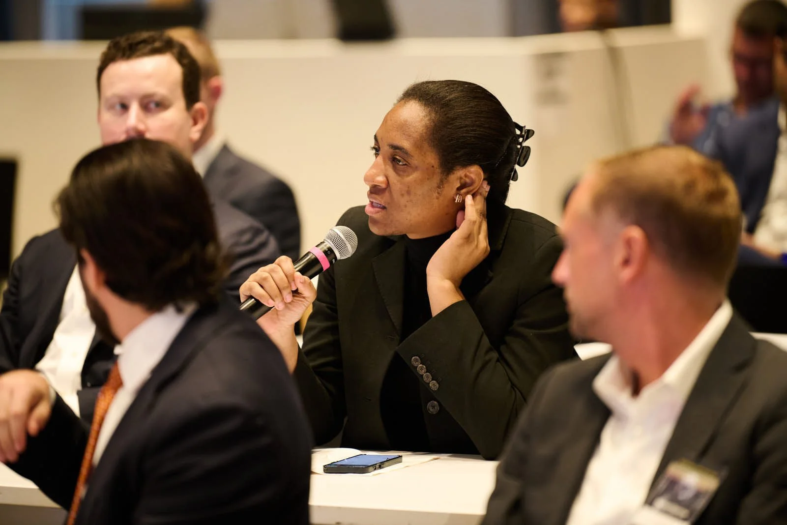 An attendee looking engaged at the Global Exchange Leader Conference for Rosenblatt 