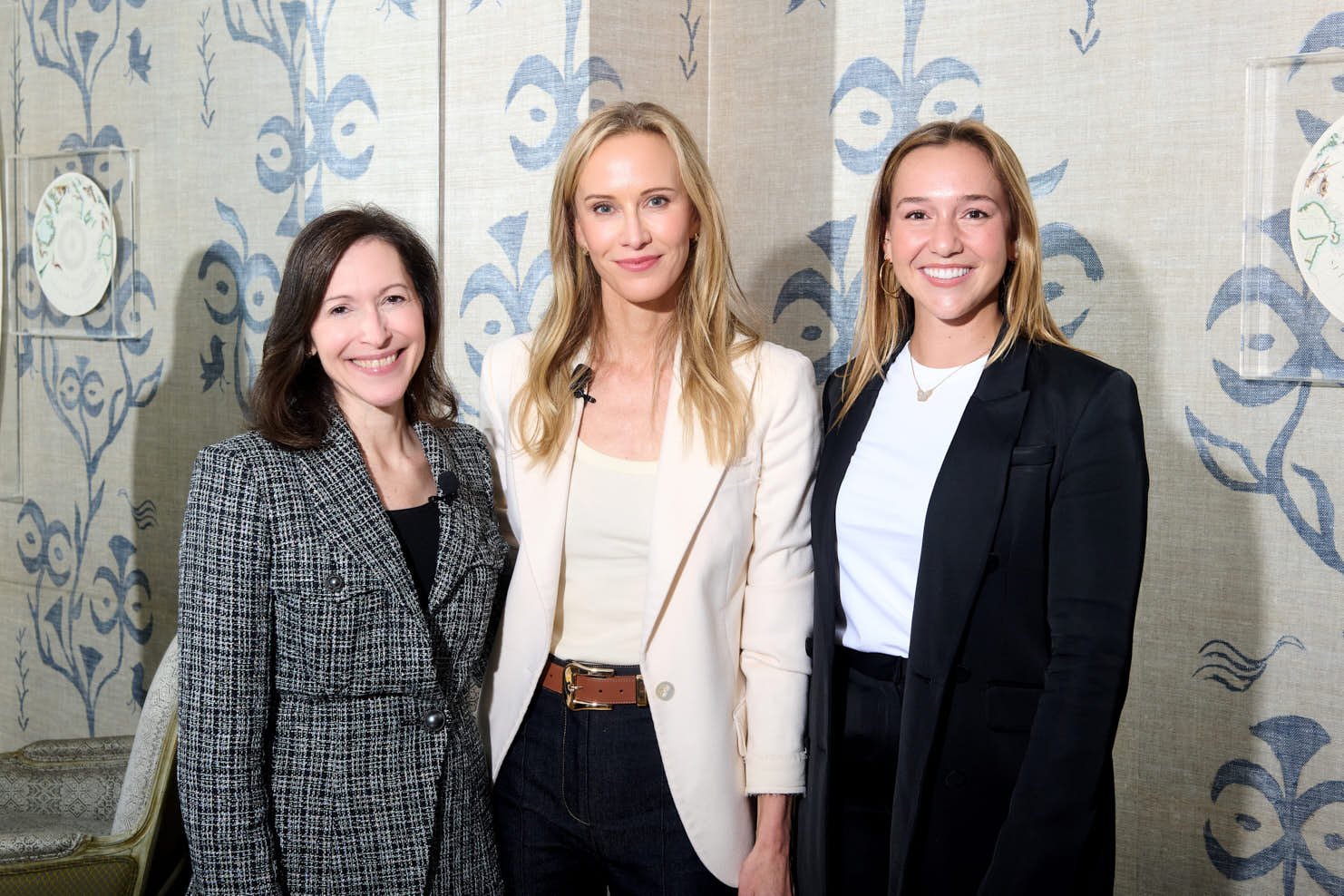 A portrait of Amy griffin with Apollo global leadership 