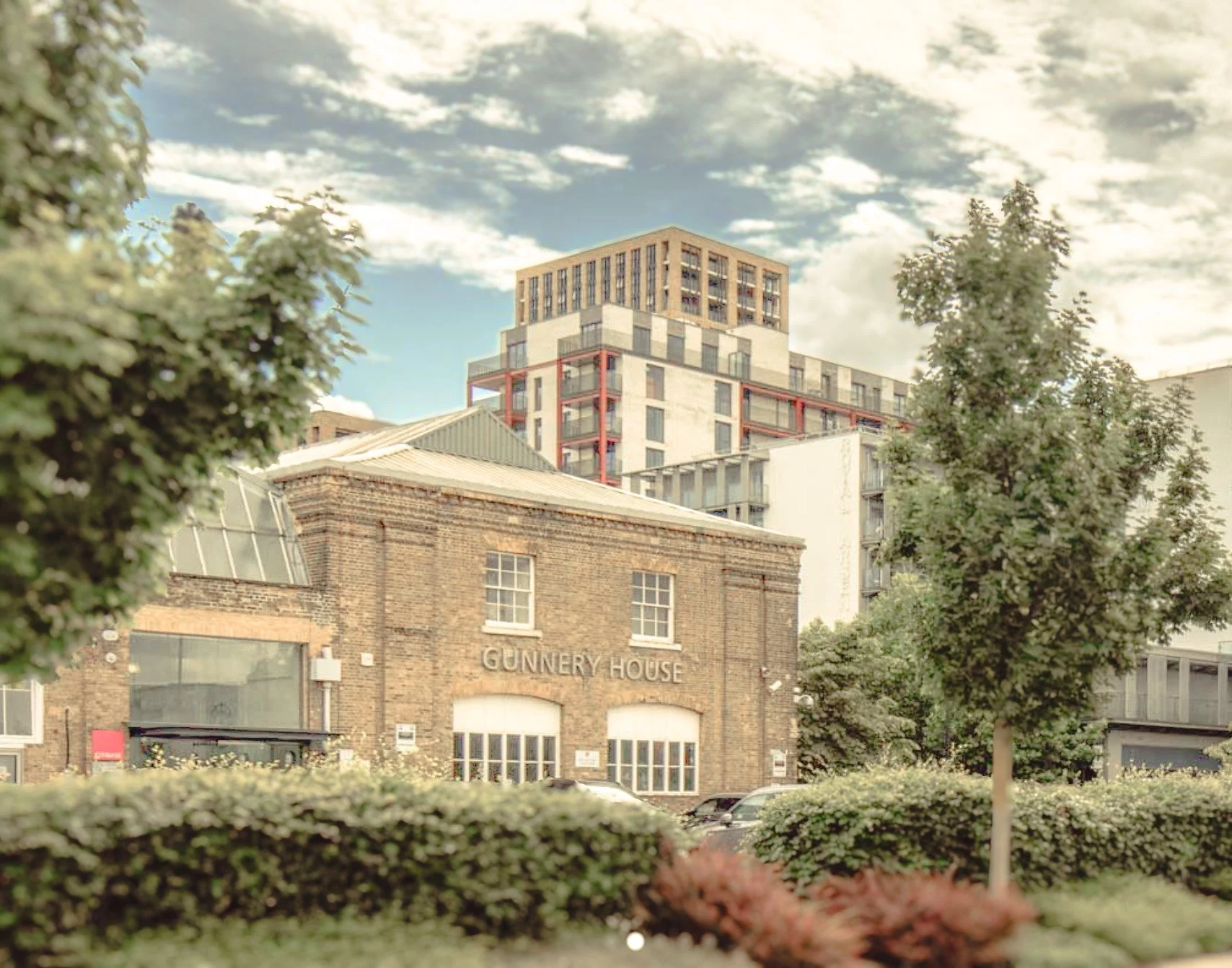 image of gunneray house building set against sky and trees