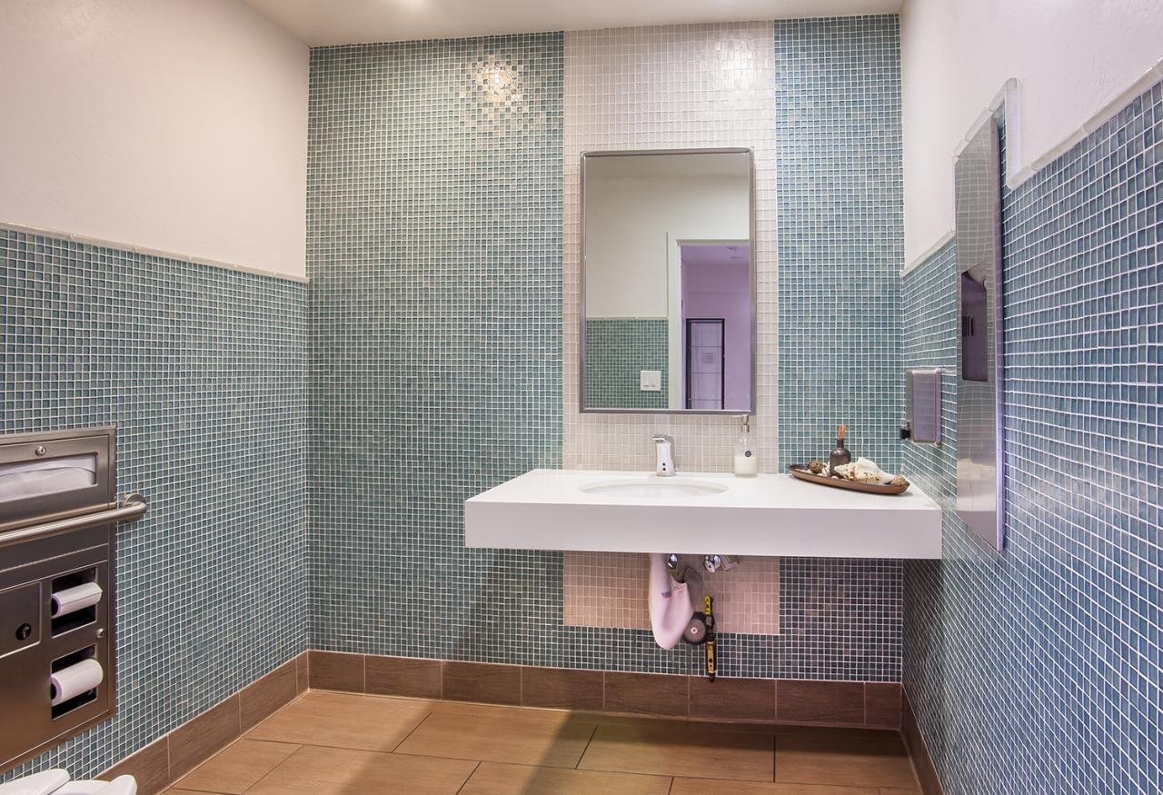 THE REDESIGNED BATHROOMS ARE A FAR CRY FROM THEIR FORMER SELVES.