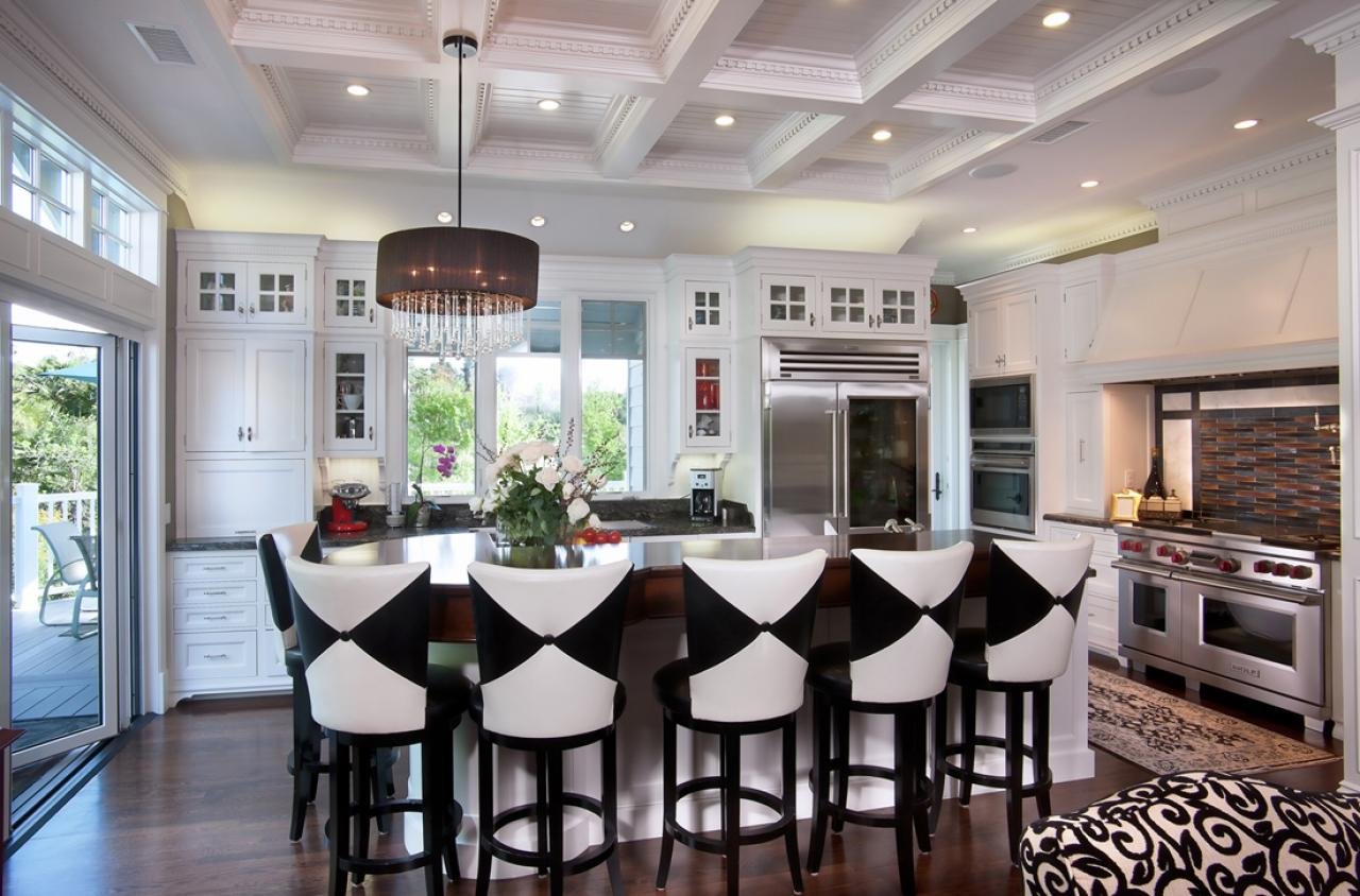 THE KITCHEN FEATURES CUSTOM CABINETS BY INPLACE DESIGN AND A CUSTOM BEADBOARD CEILING WITH DENTIL MOLDING.