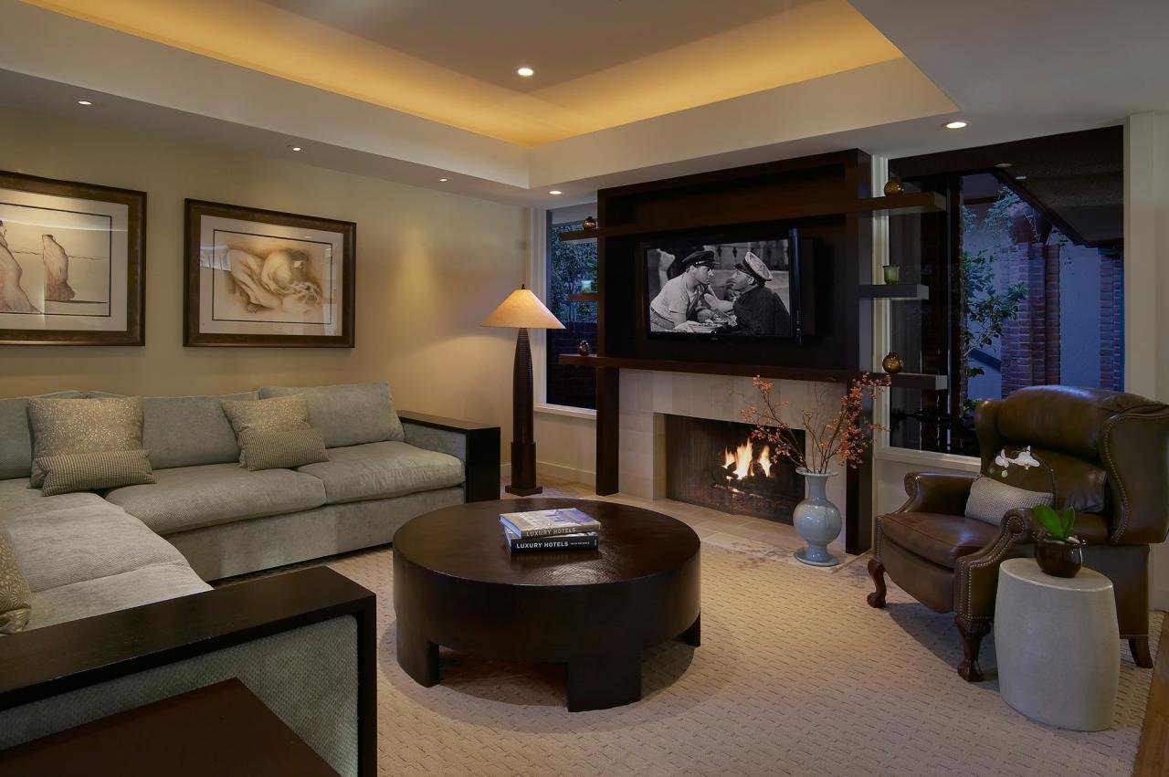 THE FAMILY ROOM FEATURES FLOATING SHELVING AND A CUSTOM SOFFIT WITH LED MOOD LIGHTING.