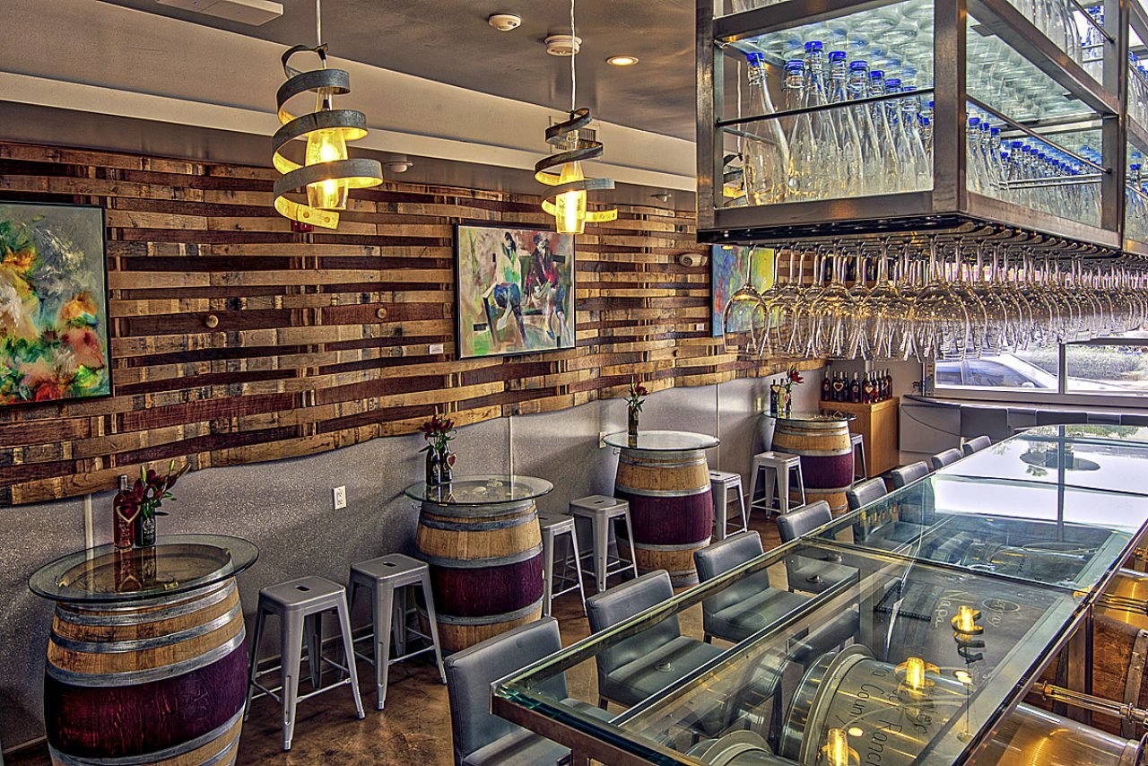 RECYCLED WINE CASKS MAKE FOR INTIMATE TABLES TO ENJOY A GLASS OR TWO.