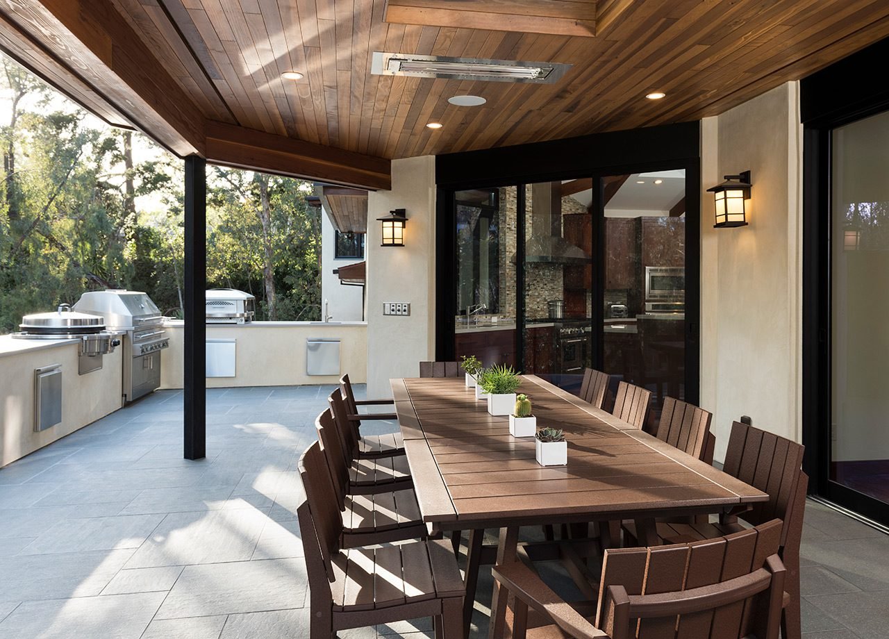 THE SPACIOUS OUTDOOR SEATING AREA IS WARMED BY RECESSED INFRATECH HEATERS.
