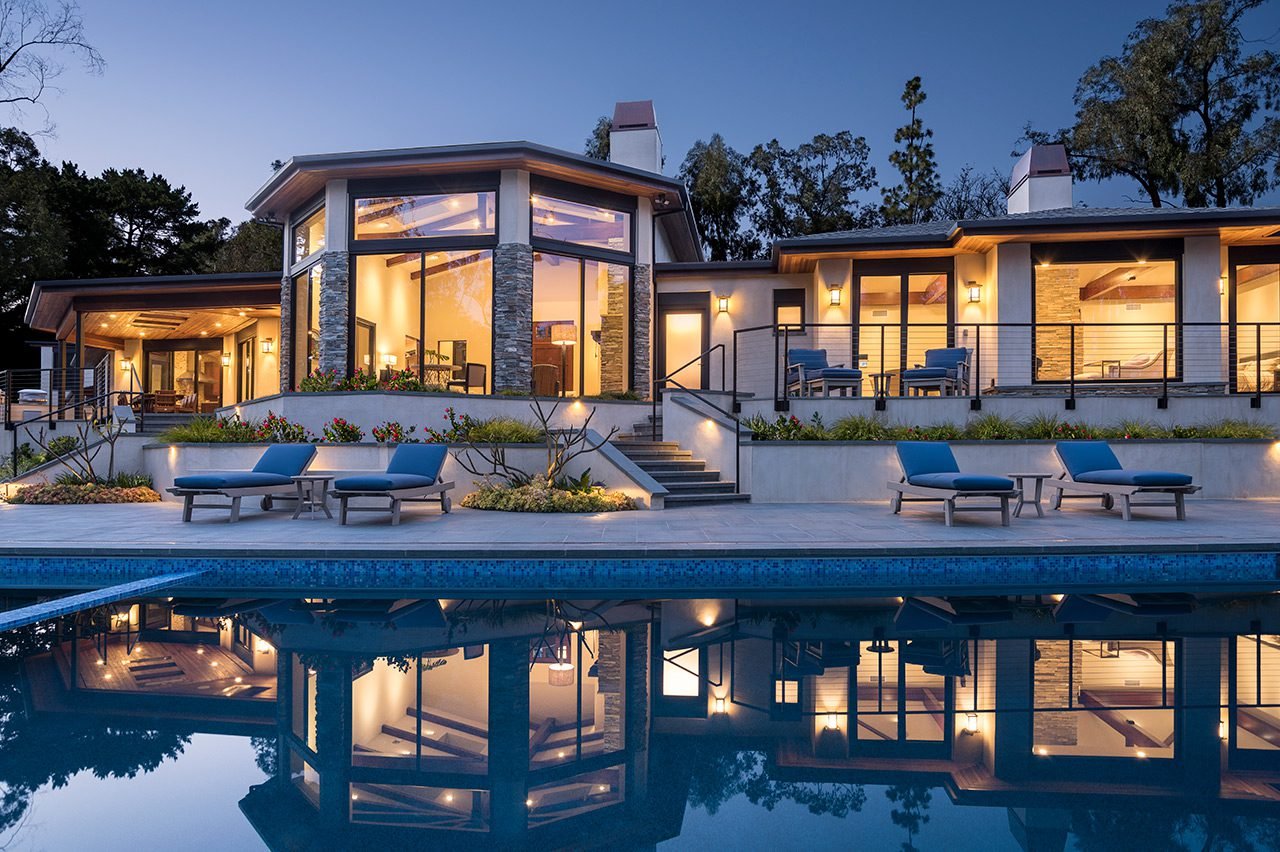 MUCH OF THE HOME’S LIVING AREA FRONTS ONTO THE STUNNING NEW POOL.