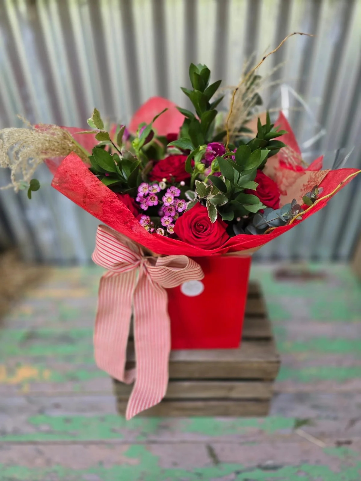 rose bouquet in red bag.JPG