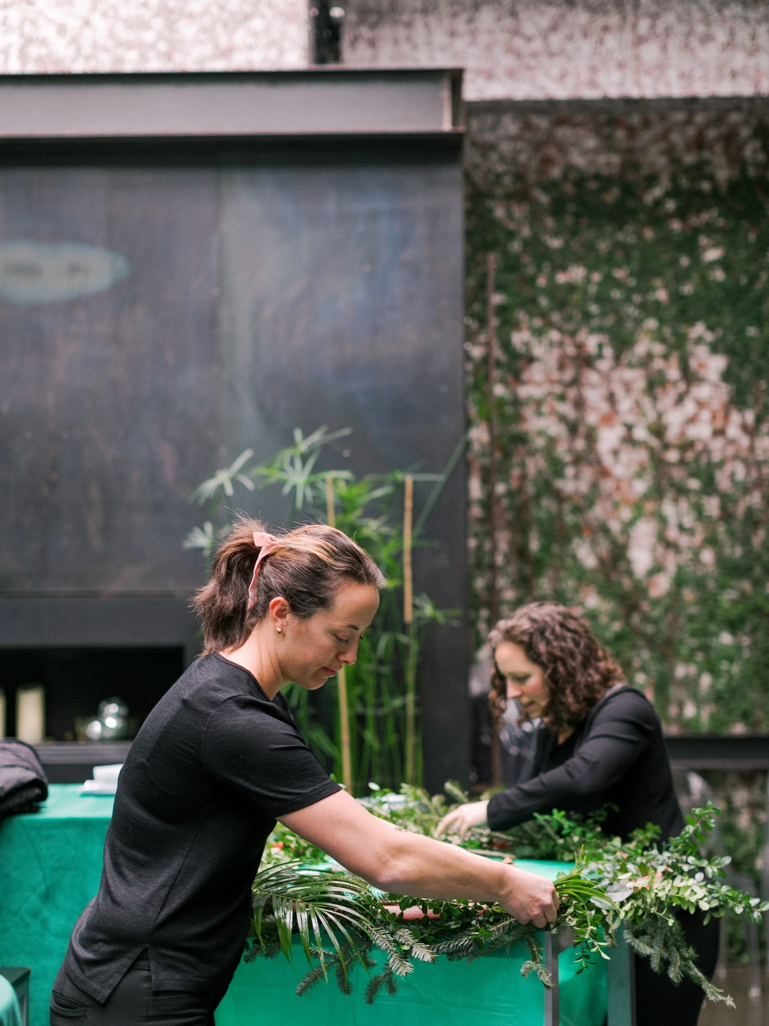 Jersey City florists setting up event florals at the bar