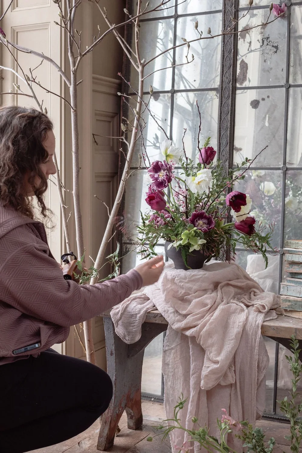 Jersey City florist setting up a floral display for photography