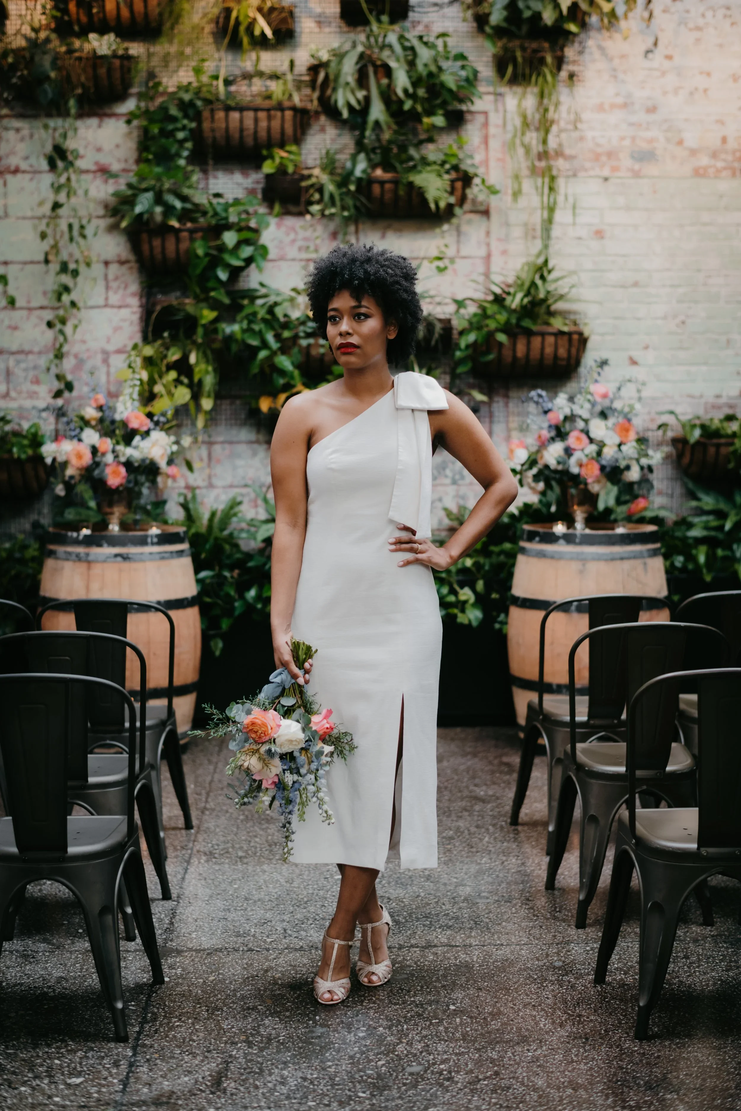bride standing with bouquet from a wedding florist in NYC