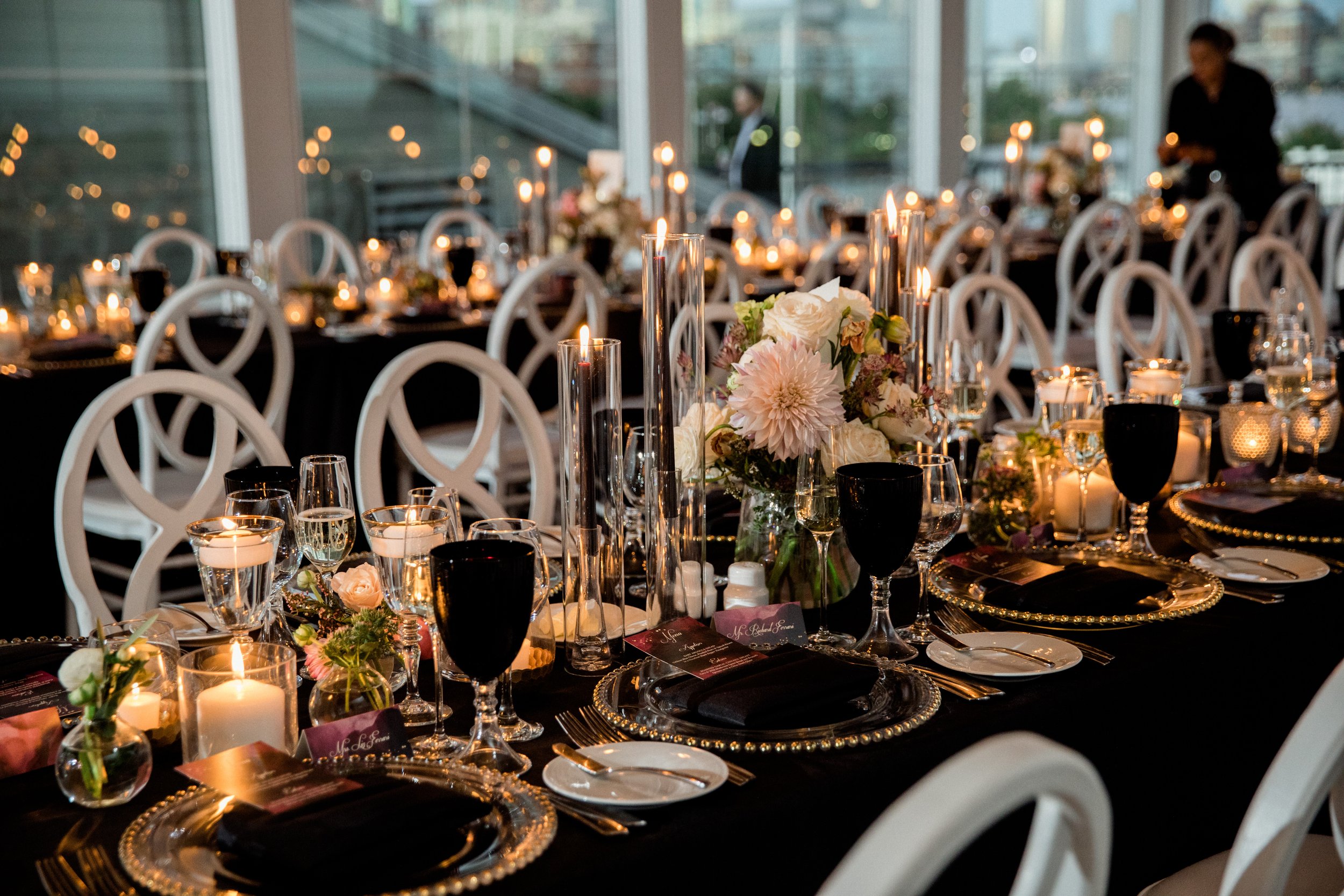 event reception tables with flowers, candles and table-settings