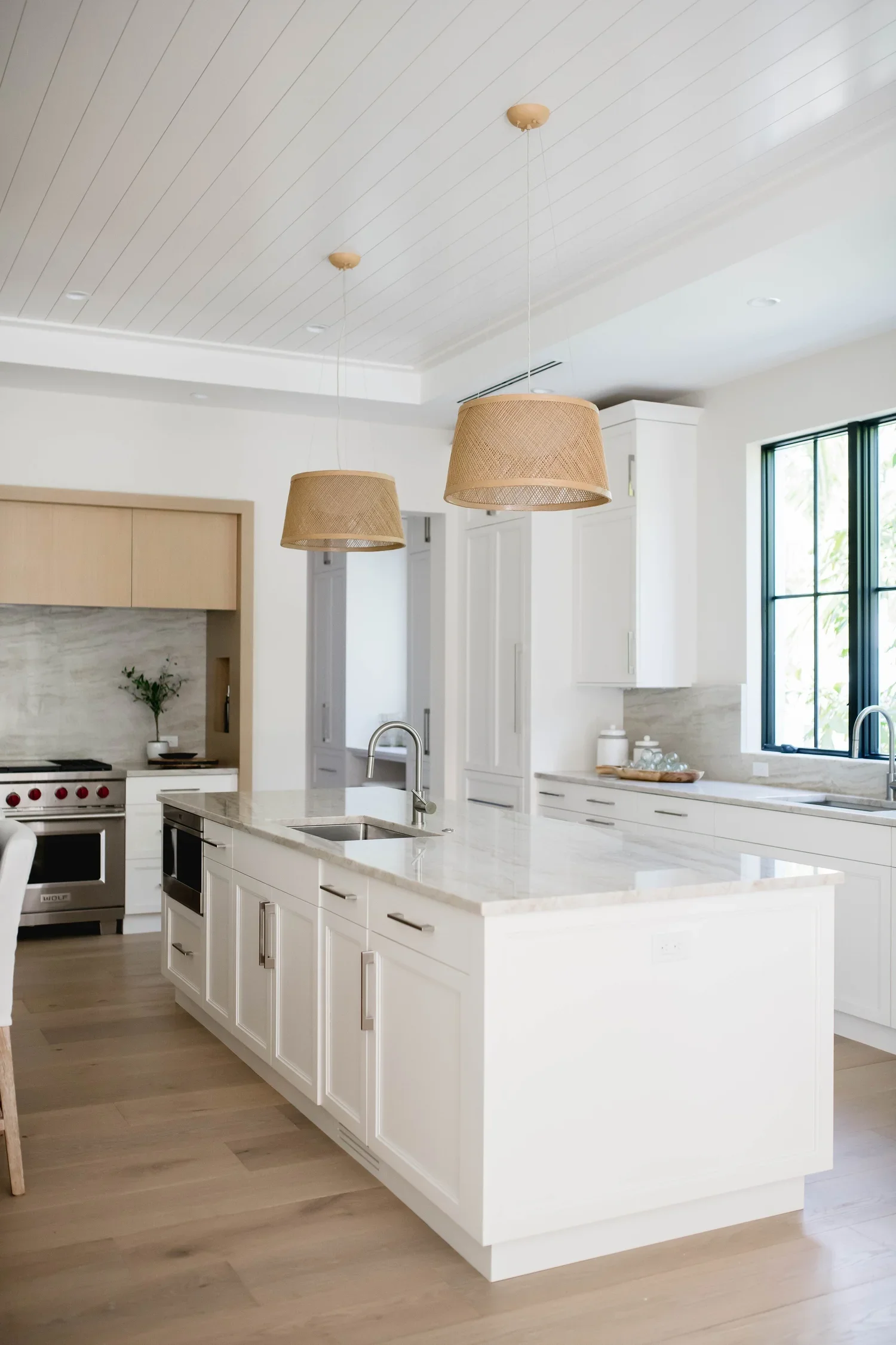 sharon-gilkey-montanna-interior-design-airy-naples-escape-kitchen-island.webp