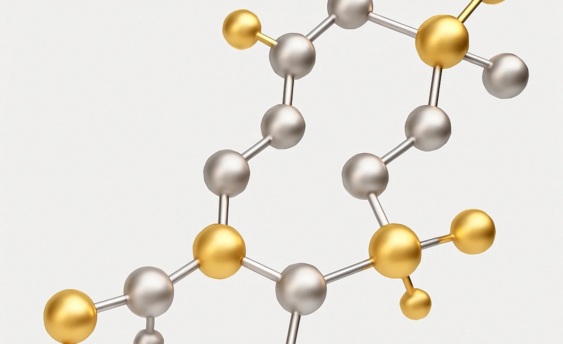 Close-up of a molecular model with silver and gold spheres connected by rods.