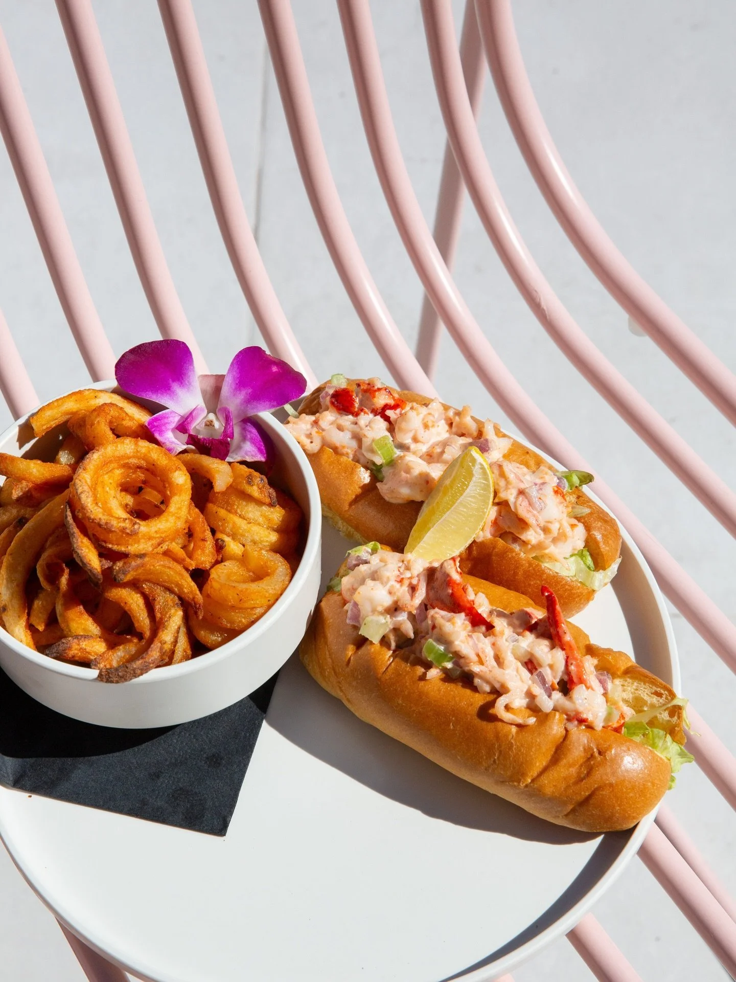 Warm heaters, bright skies, and our Monday Lobster &amp; Shrimp Roll deal: two rolls, fries, and a cocktail for $25.