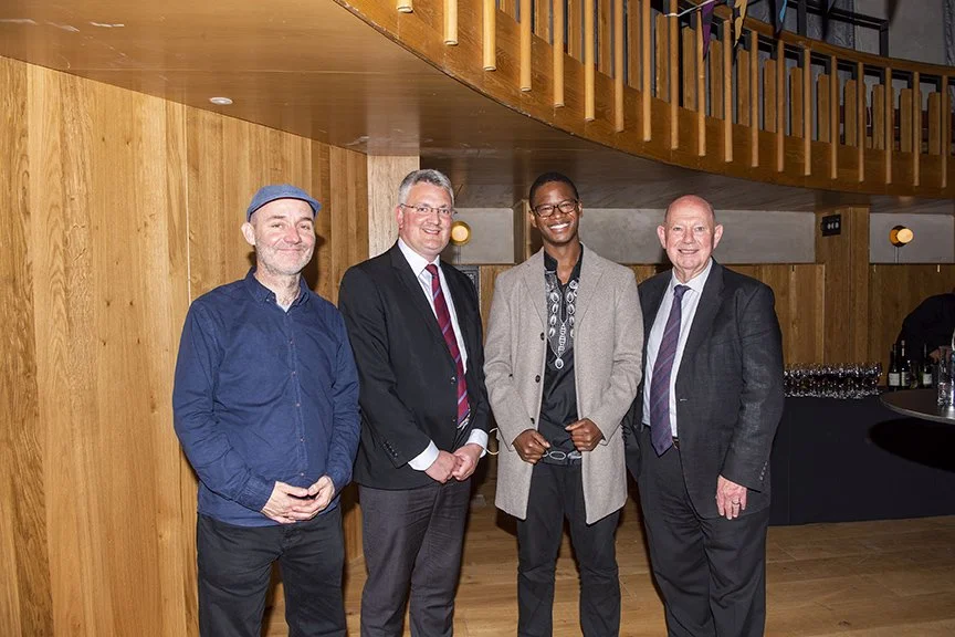 Thanda Gumede with Sir Richard Mantle, Deputy Mayor Cllr James Lewis and Mr D. Evans after performing at a private event at the Howard Assembly in Leeds, U.K.