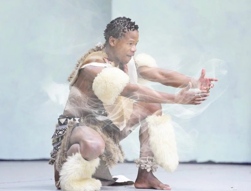 Thanda Gumede demonstrating a traditional Zulu Warrior dance routine during and leading a dance workshop at a school in Liverpool, U.K.