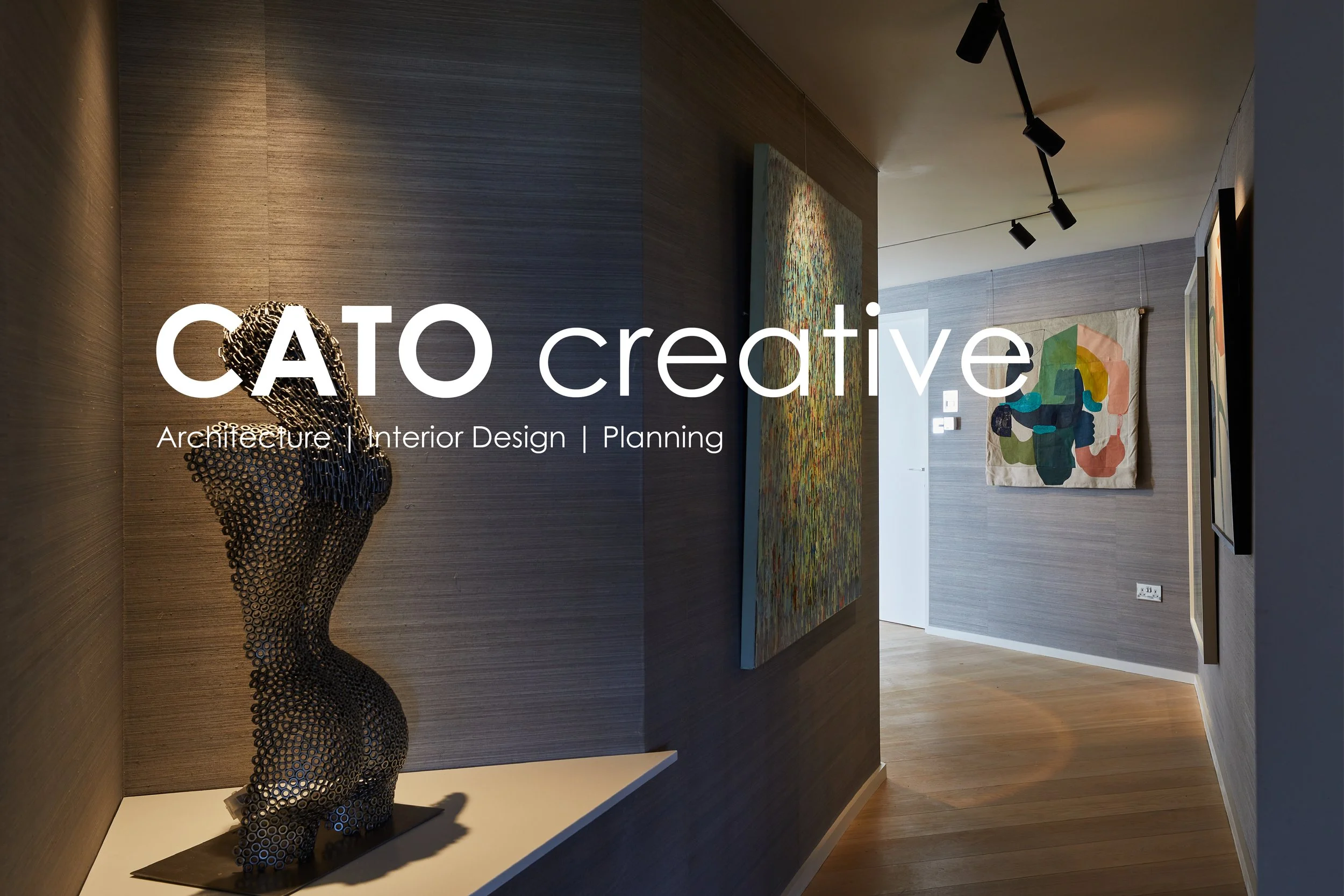 ABG Architecture & Interior Design Ltd (t/a CATO Creative) — Interior of an art gallery with paintings on the walls and a modern sculpture of an abstract human figure on display.
