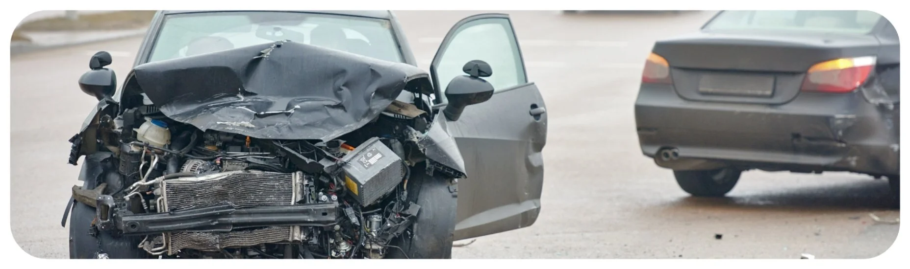 Severely damaged car after a head-on collision, representing Iowa car accident injury cases involving major frontal impacts.