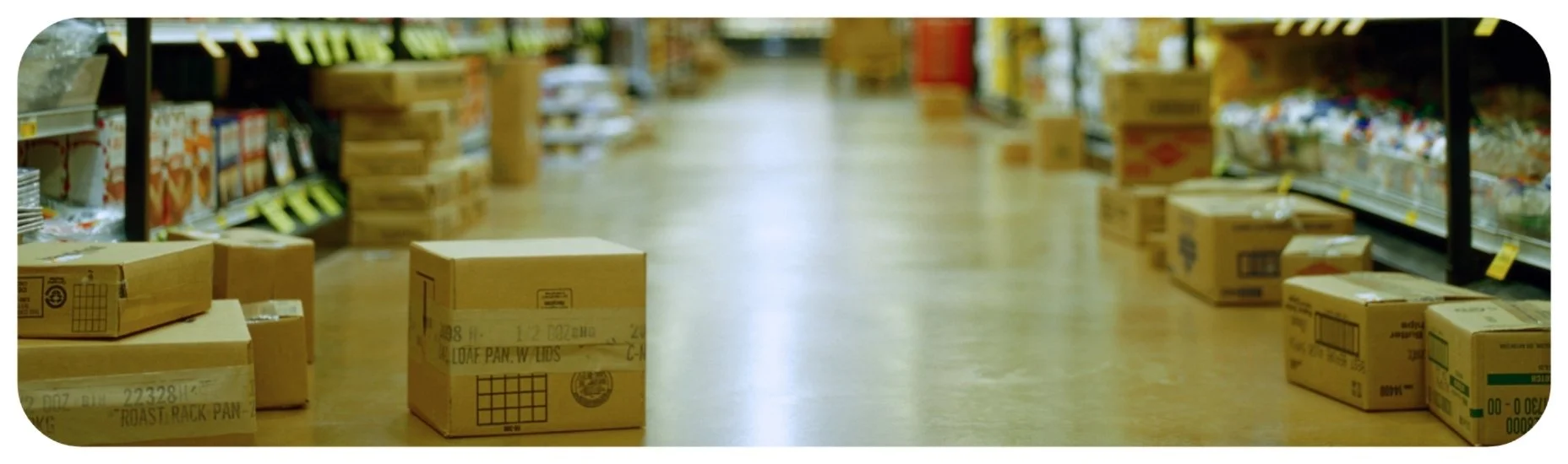 Cardboard boxes left in an Iowa grocery store aisle creating a tripping hazard for customers.
