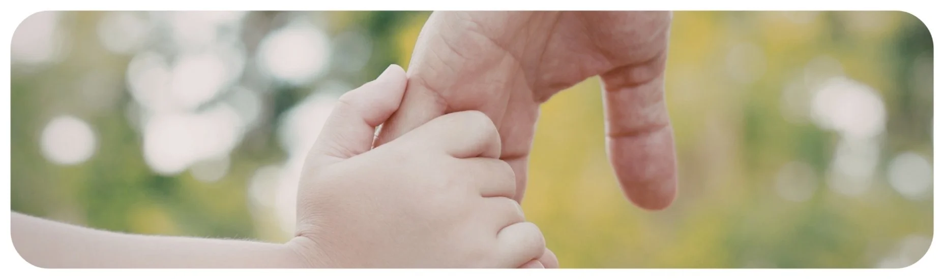 Parent holding a child’s hand, symbolizing protection and support after a serious child injury.