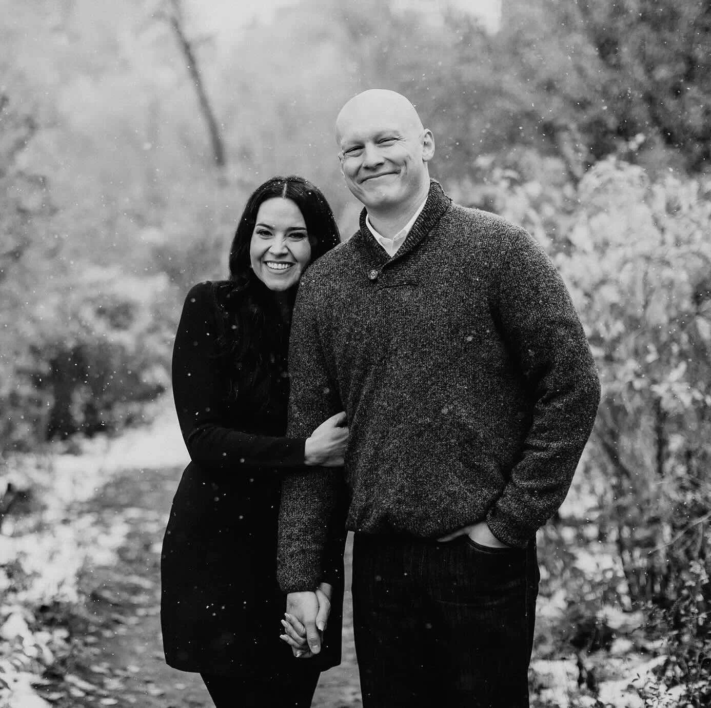 Nathaniel D. Staudt and his wife smiling together in a black-and-white portrait featured on the About section.