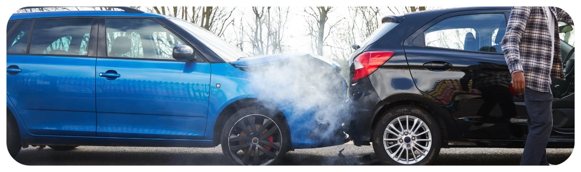 Rear-end car accident in Iowa involving an underinsured driver, with vehicle damage and smoke after the collision.