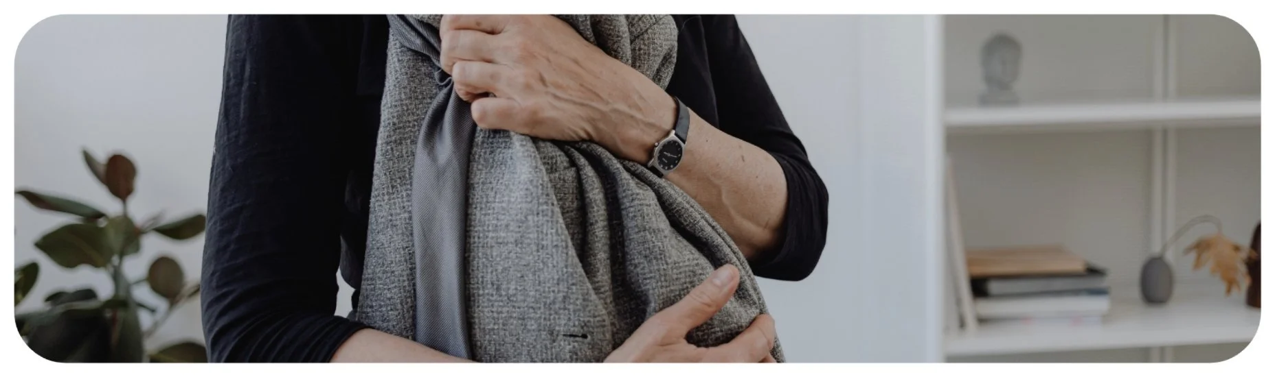 Person holding a loved one’s clothing while grieving a wrongful death in Iowa.