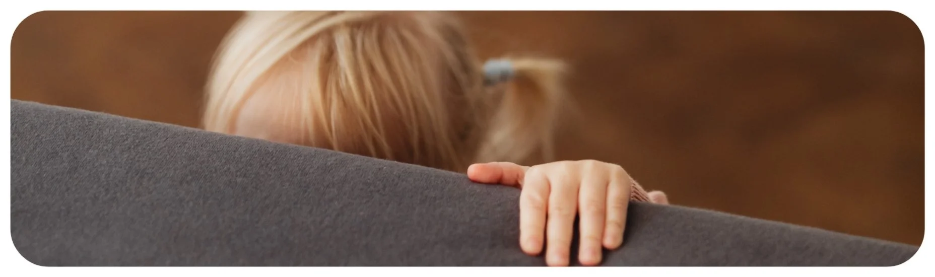 Young child seeking comfort and protection, representing Iowa injury cases involving harm to children and the need for accountability.