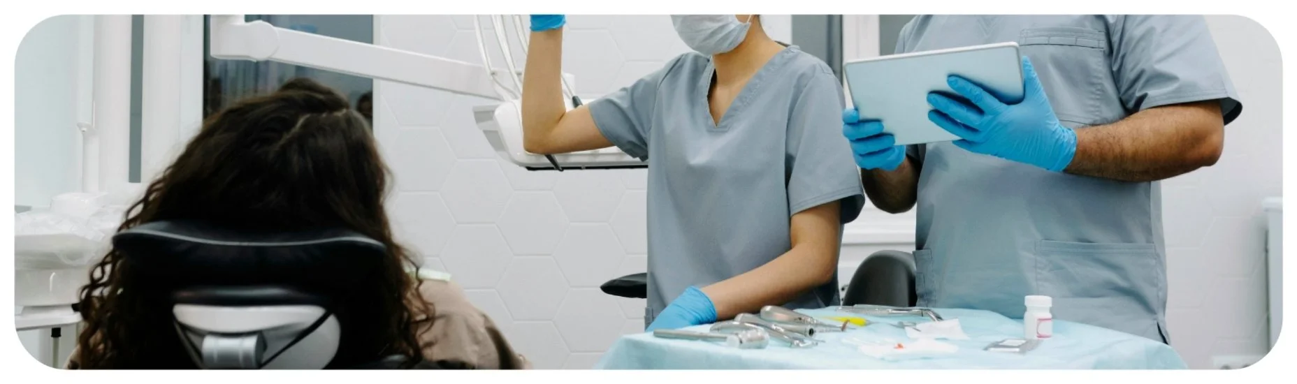 Dental professionals performing a procedure, representing Iowa dental malpractice cases involving treatment errors, improper supervision, and charting failures.