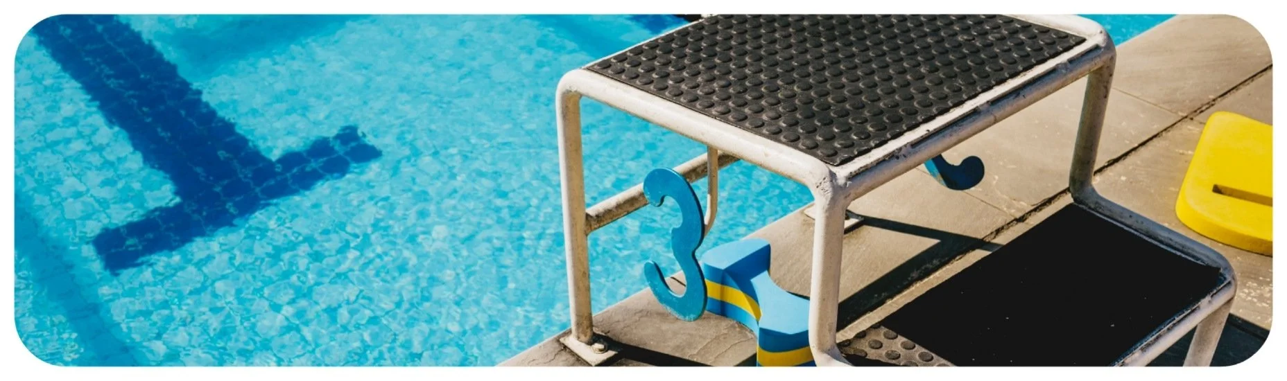 Swimming pool starting block and pool edge illustrating potential swimming pool accident hazards in Iowa.