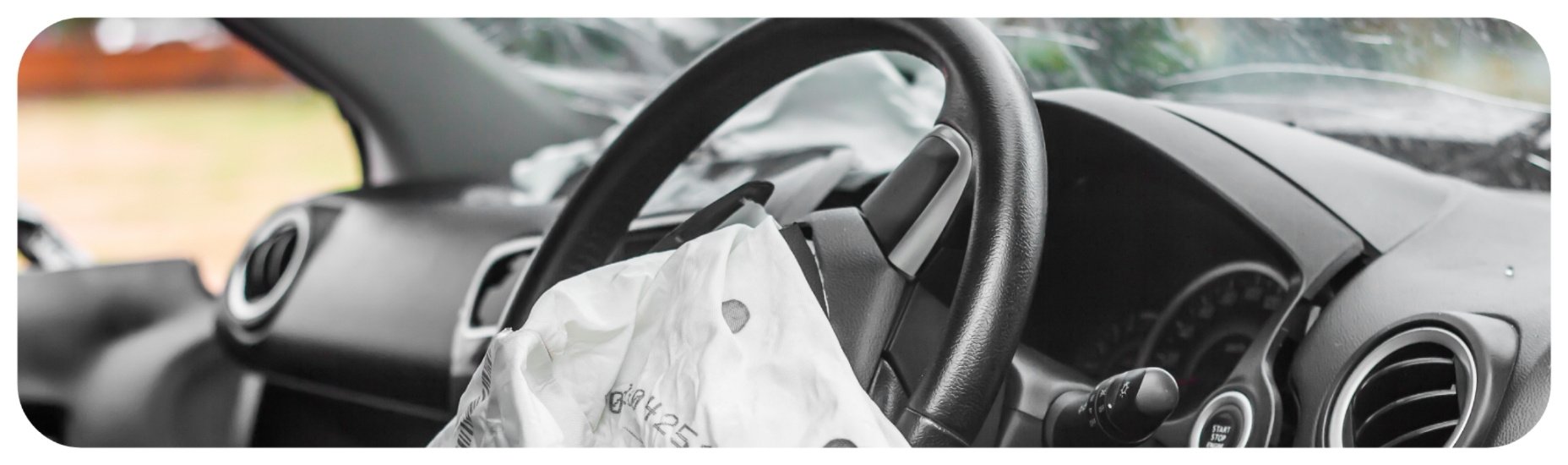 Deployed airbag inside a vehicle after a serious crash, representing Iowa car accident injury cases involving high-impact collisions.