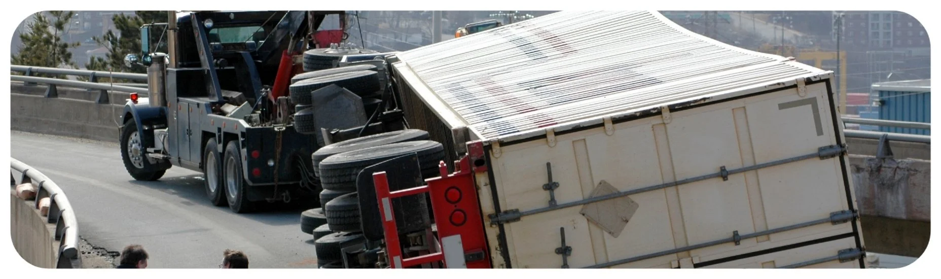 Overturned commercial truck and semitrailer involved in a serious highway accident in Iowa.