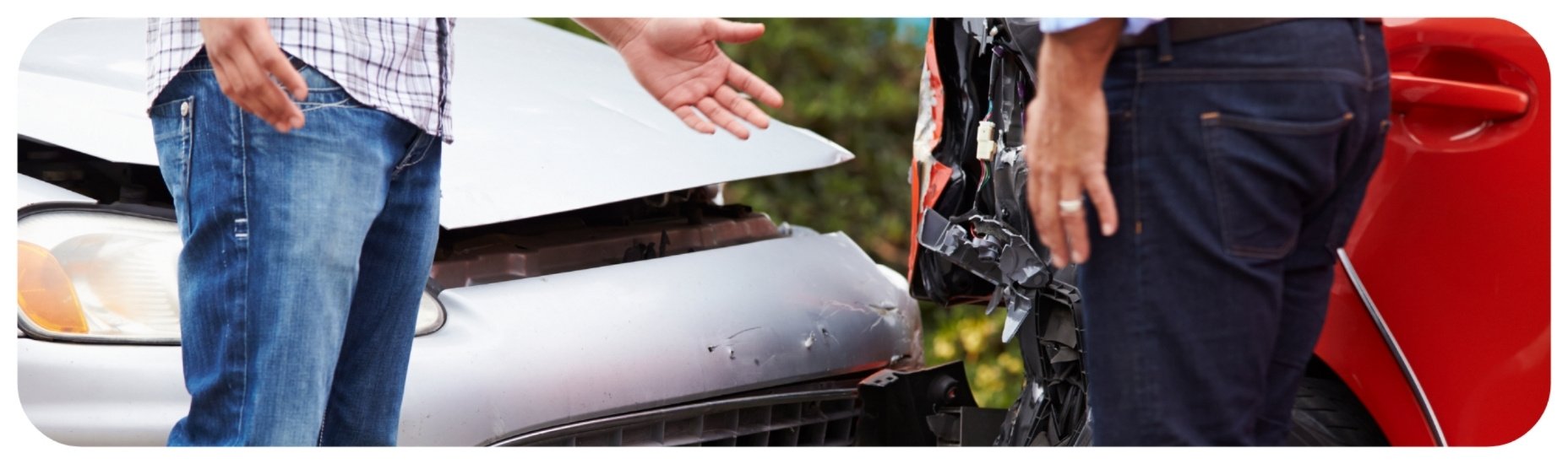 Drivers standing beside damaged vehicles after a car accident in Iowa.