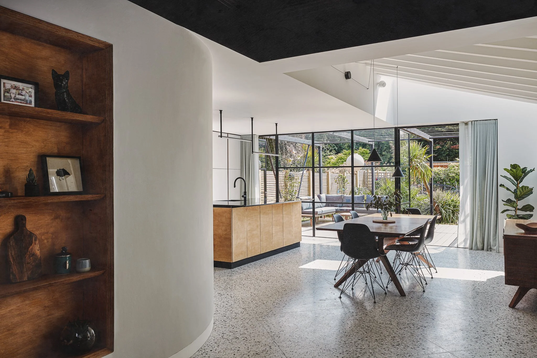 Contemporary rear house extension in London with kitchen and dining space opening onto garden