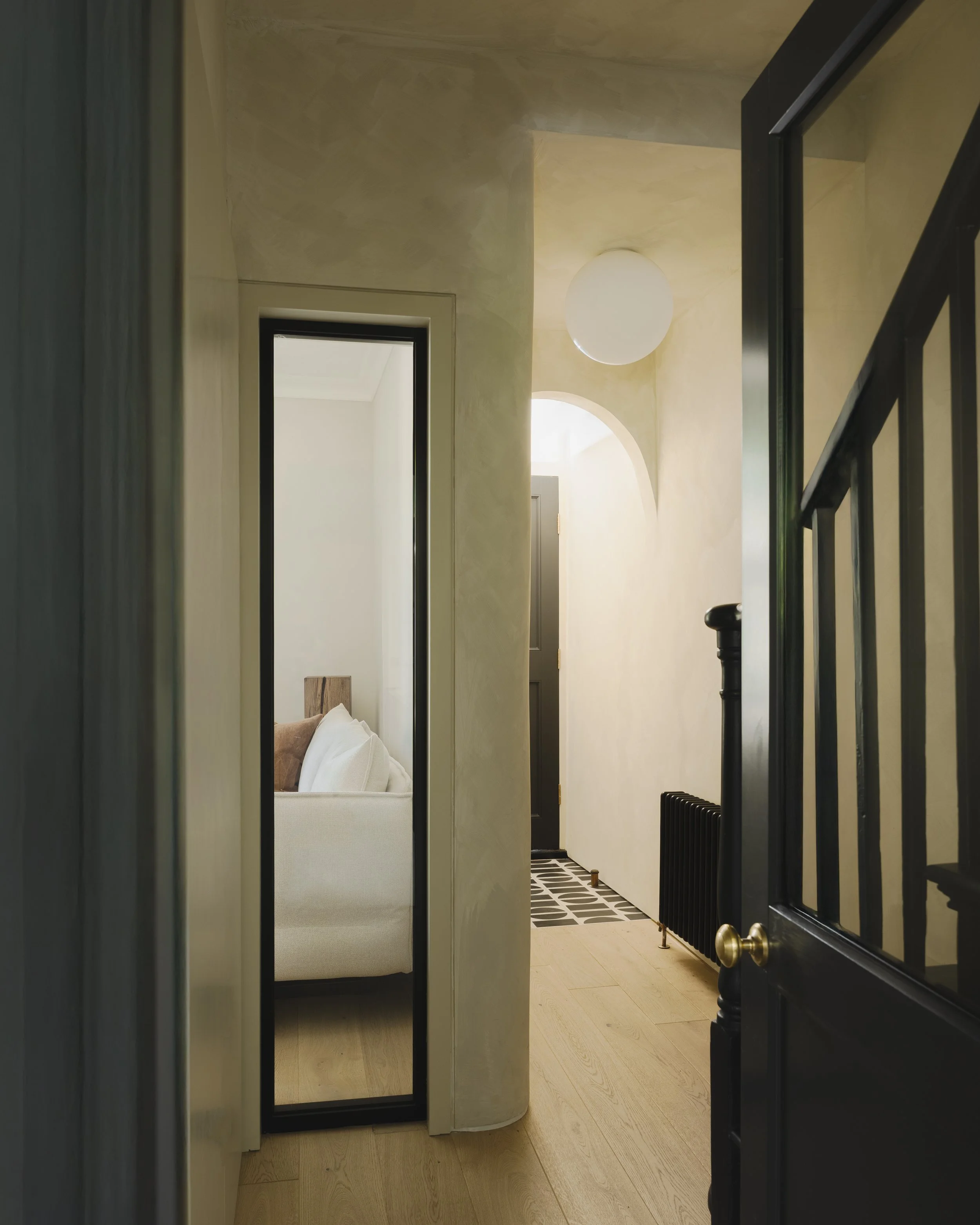 Dark central hallway in Victorian house with limited natural light