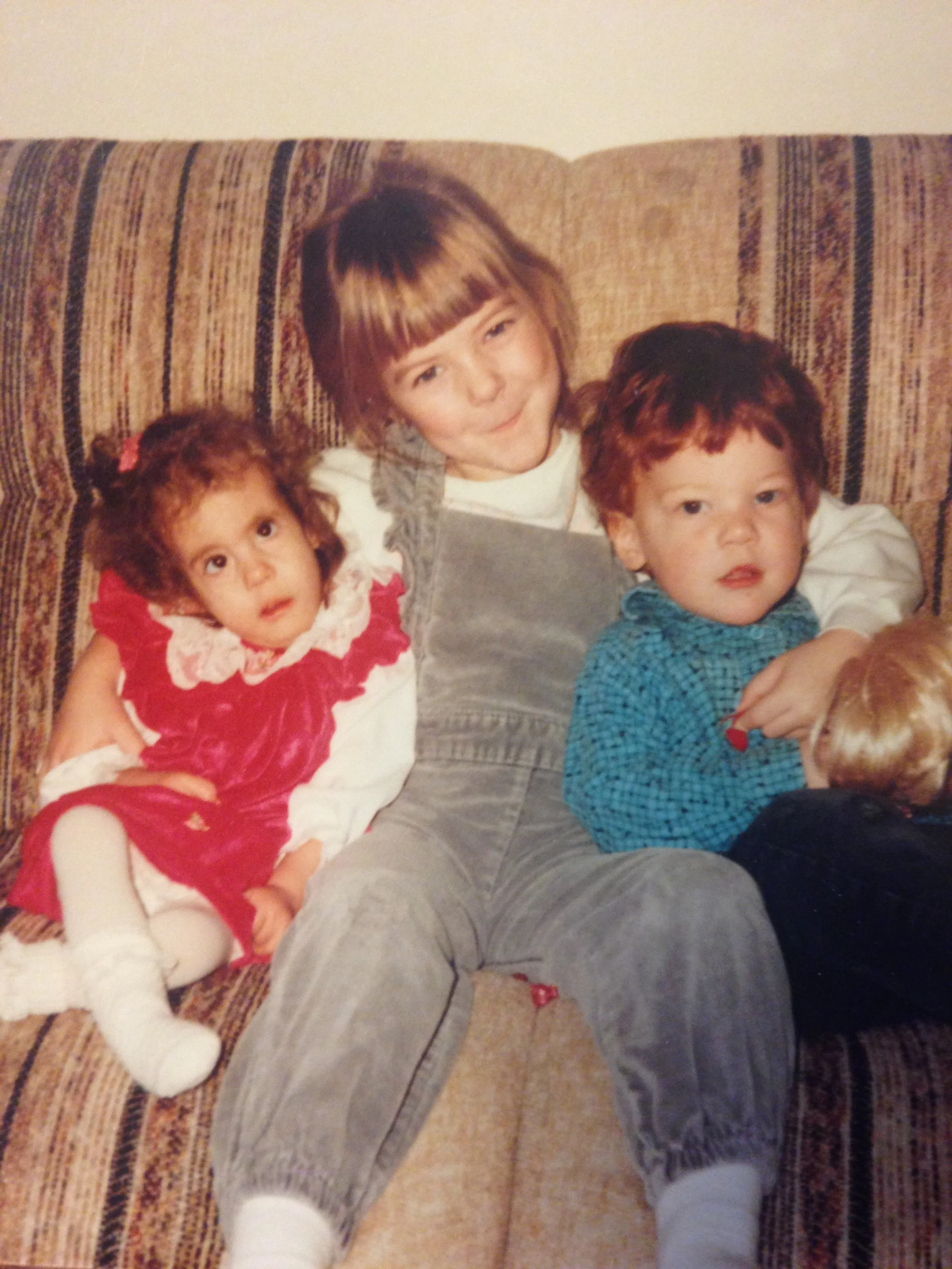 siblings on a couch