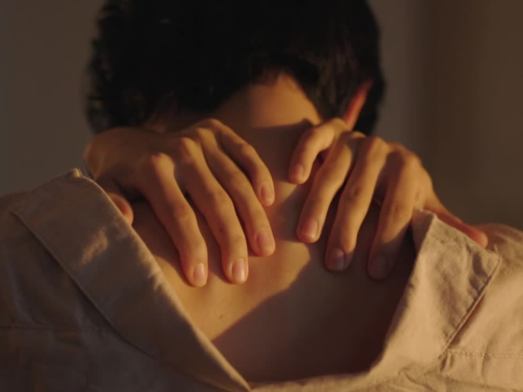 woman wth hands on her back