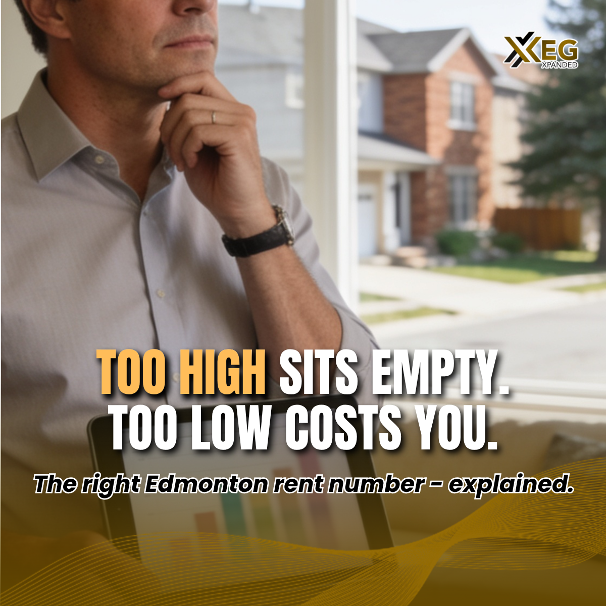 A YEG Xpanded property manager reviews comparable rental data on a tablet inside a bright Edmonton rental property, representing data-driven rental pricing strategy services.