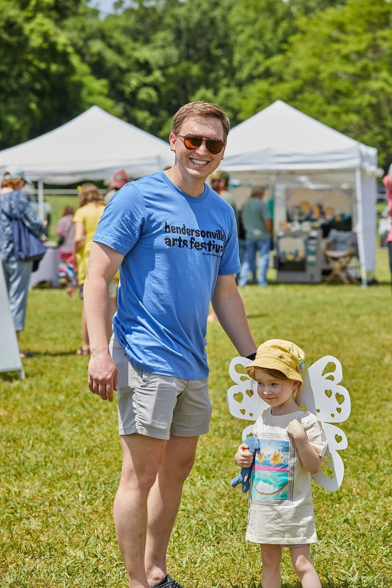 Volunteer smiling with child