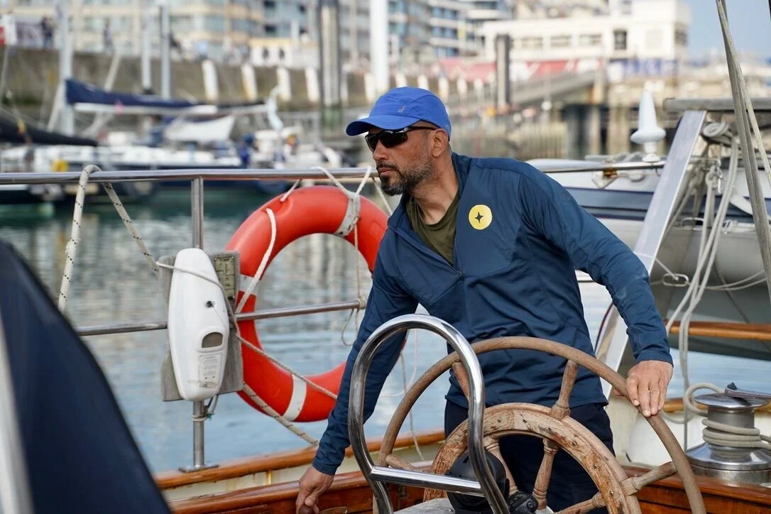 Skipper steering the schooner Spirit of Ostend while entering Ostend harbour