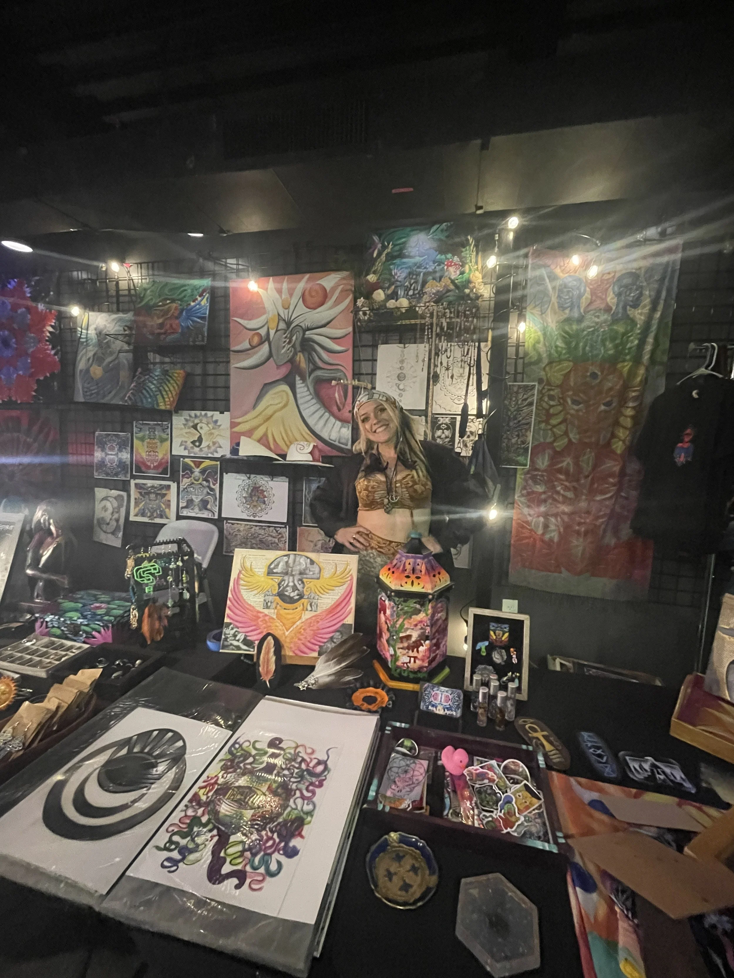 Sea The Spirit art booth with original paintings and prints
