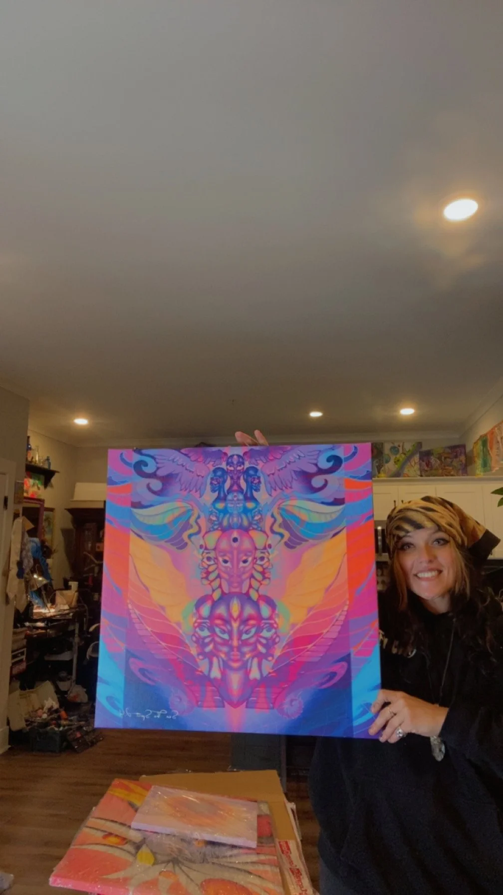 Courtnie May presenting a vibrant Sea The Spirit canvas