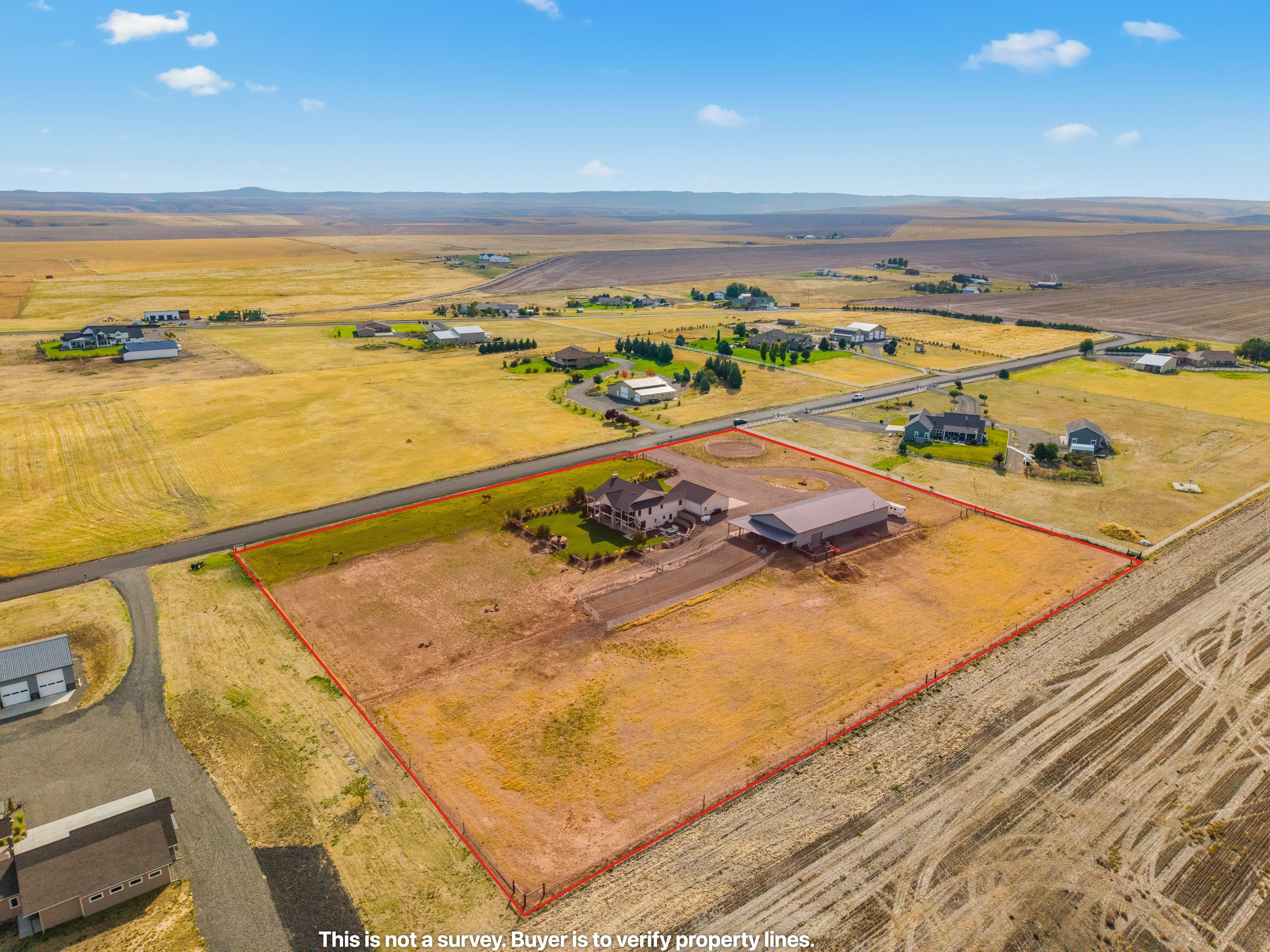 Aerial of fenced pasture and barn/shop on 5 acres