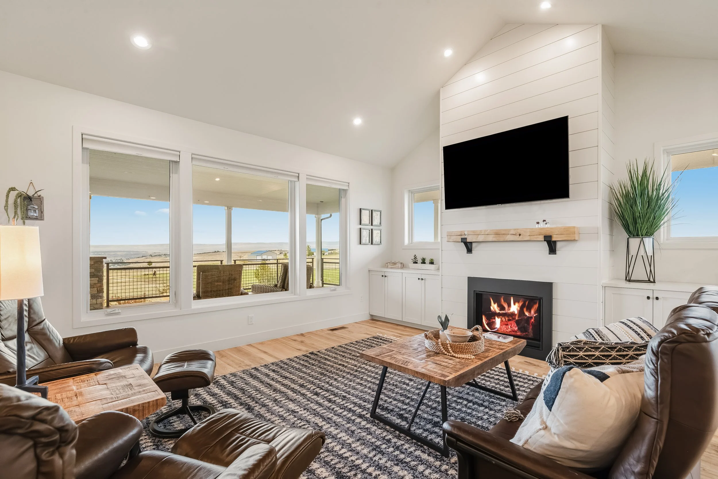 Living room with vaulted ceiling and propane fireplace