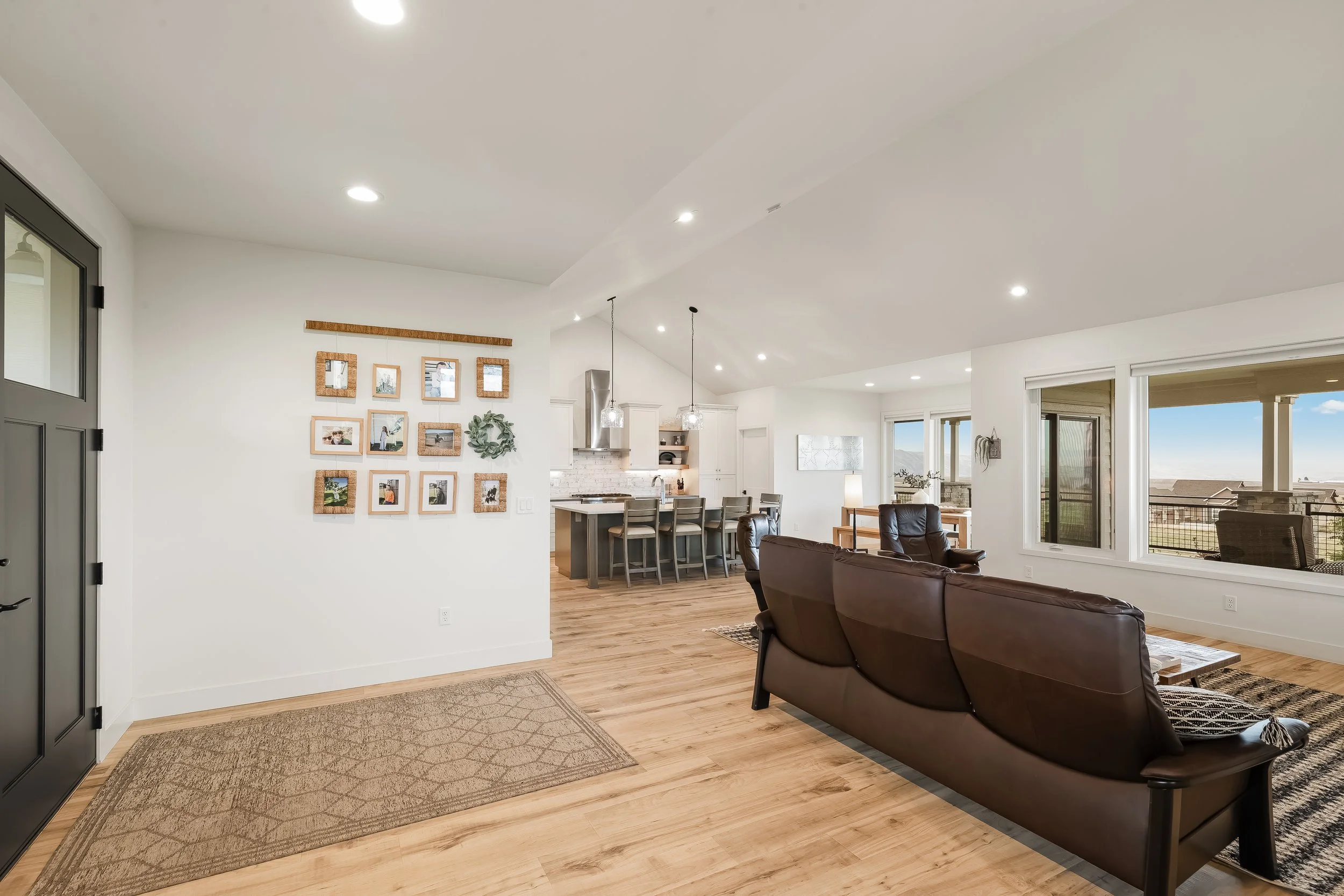Open living room with engineered hardwood and valley views