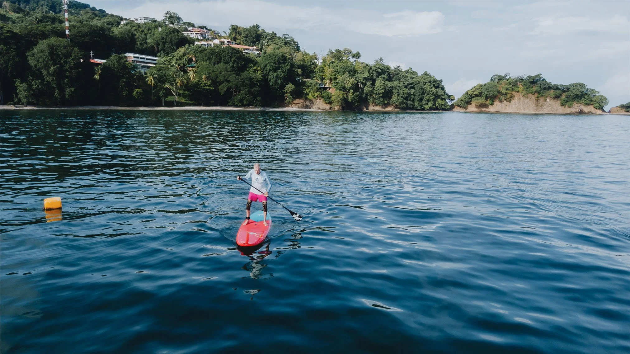 senior-suping-in-glassy-ocean-costa-rica.jpg
