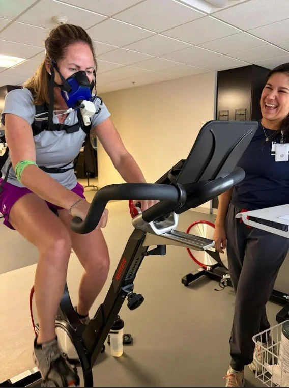 Woman testing her VO2 max on a stationary bike.