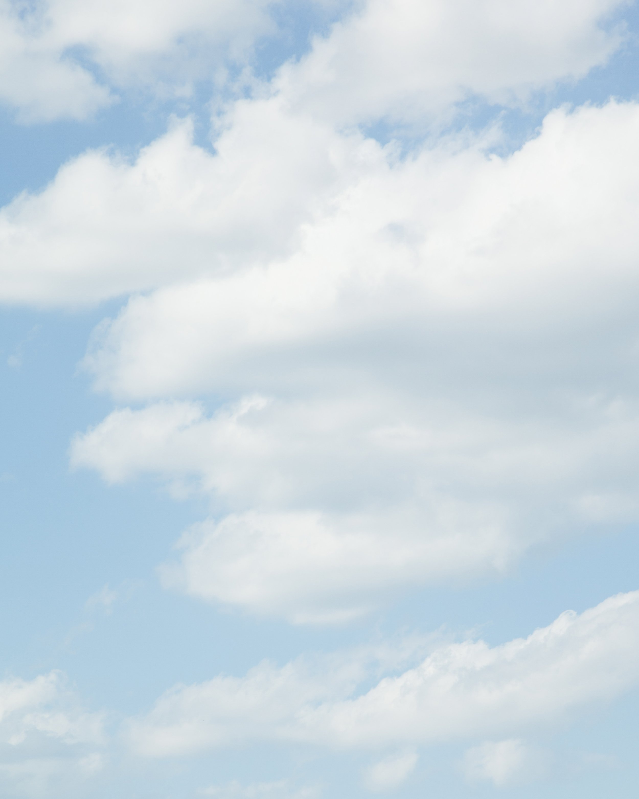 Sky with scattered clouds.