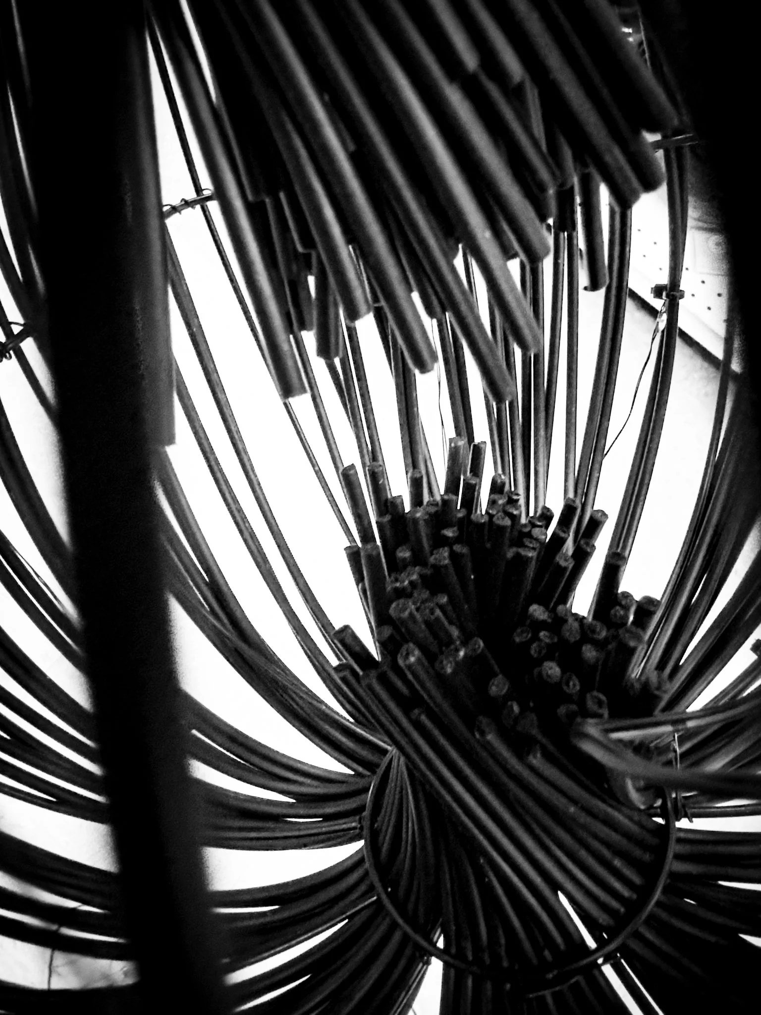 Close-up view of the handles and wires of a wheel chair.