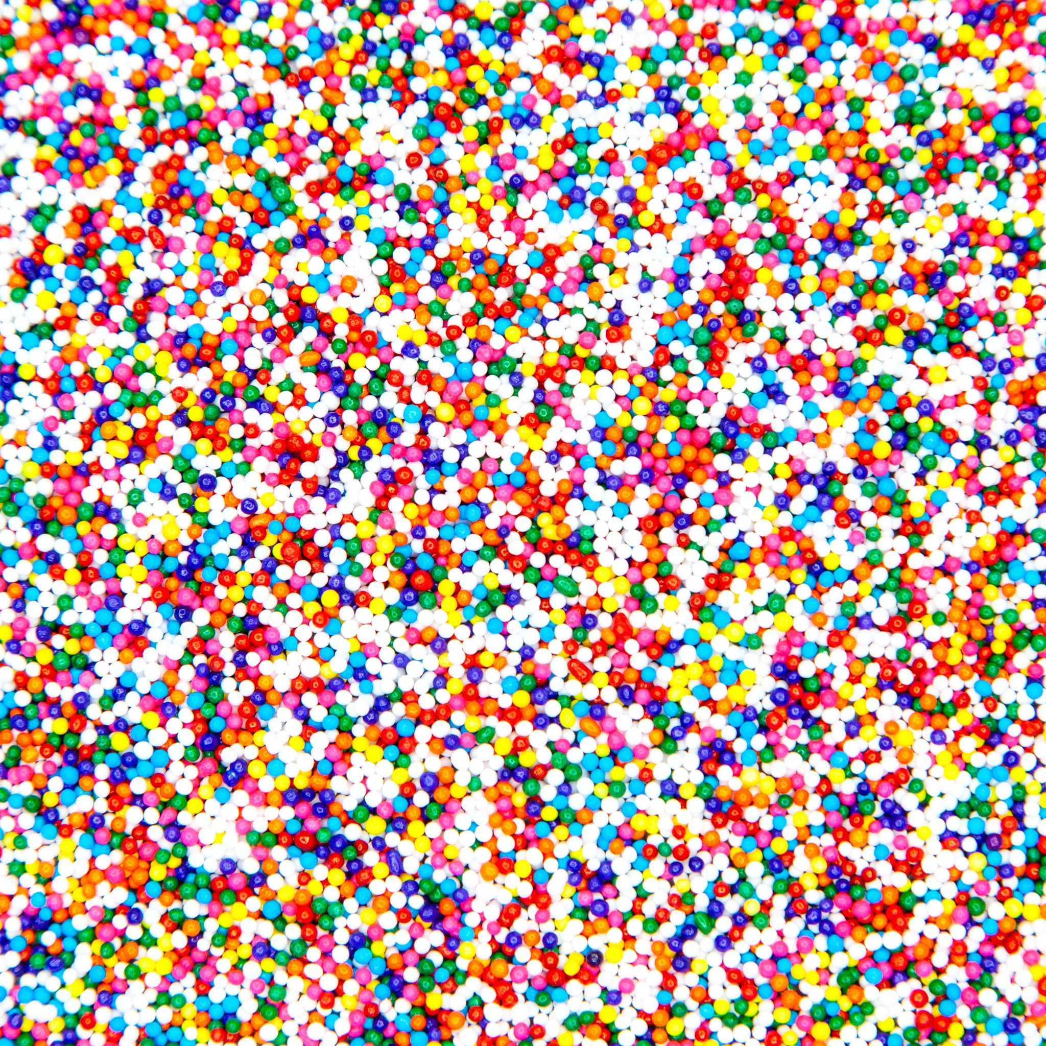 Close-up view of multicolored tiny round sugar sprinkles